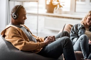 young person listening to music