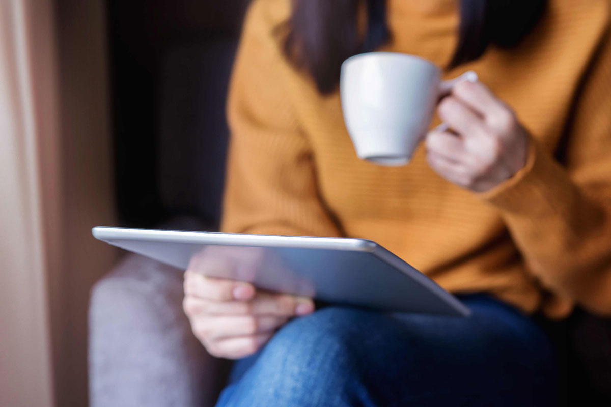 woman reading on a tablet
