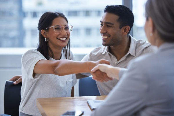 couple speaking with a social worker