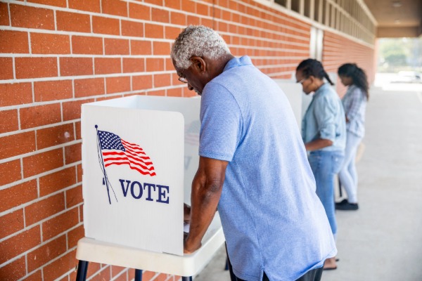 man in voting booth