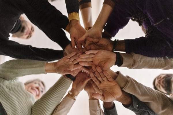 hands reaching toward each other